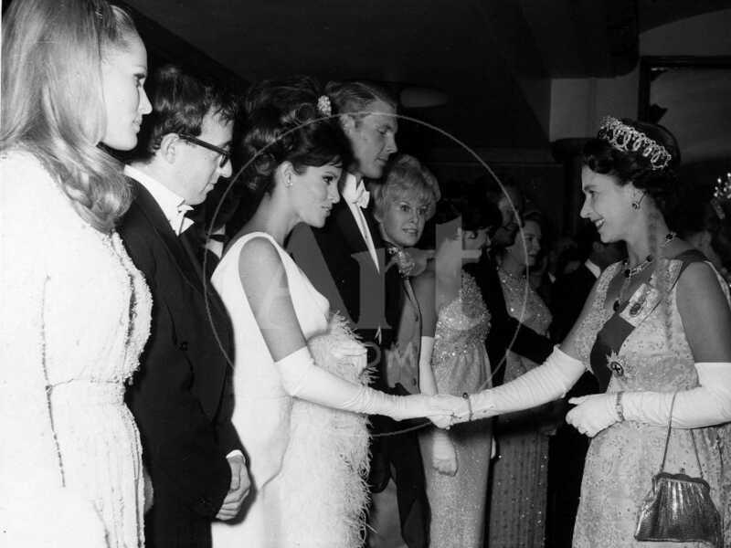 Raquel Welch Meets Queen Elizabeth in 1966 with Woody Allen and Ursula Andress - Photographic Print