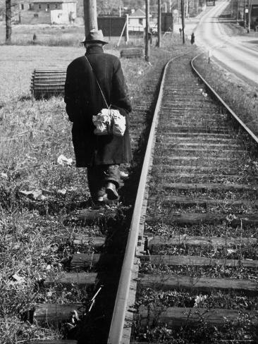 http://imgc.artprintimages.com/images/art-print/carl-mydans-elderly-hobo-with-bundle-strapped-to-his-back-walking-along-train-tracks_i-G-26-2696-VBSUD00Z.jpg
