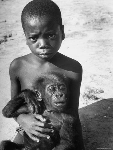  Baby Names on Local Tribe Youngster Holding A Baby Gorilla Names Bobo After The