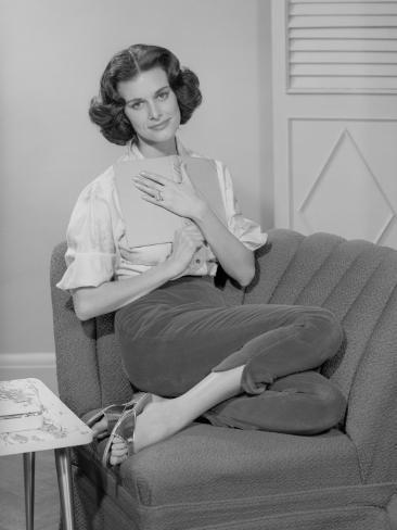 http://imgc.artprintimages.com/images/art-print/george-marks-woman-hugging-book-to-chest-on-arm-chair-portrait_i-G-56-5638-CAZMG00Z.jpg