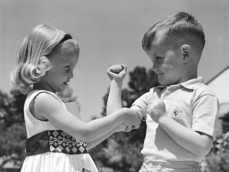 Boy Flexing Muscles, Flirting With Girl Photographic Print by H