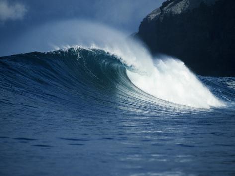 http://imgc.artprintimages.com/images/art-print/jeff-foott-detailed-view-of-a-curling-wave-in-the-surf-with-a-large-rock-formation-in-background_i-G-49-4921-QOU9G00Z.jpg