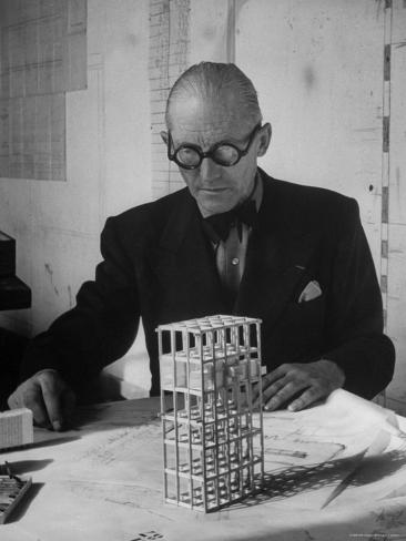 Architect Le Corbusier Studying Architectural Plans and Small ...