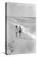 1930s 1940s COUPLE WEARING BATHING SUITS WALKING TALKING TOGETHER ON BRIGHT WARM SUNLIT SEASHORE...-H. Armstrong Roberts-Premier Image Canvas