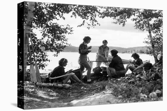1930s 5 GIRLS AROUND CAMP FIRE NEAR LAKE CANOE SUMMER YOUTH ALGONQUIN PARK CANADA-H. Armstrong Roberts-Premier Image Canvas