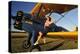 1940's Style Pin-Up Girl Sitting on the Wing of a Stearman Biplane-null-Premier Image Canvas
