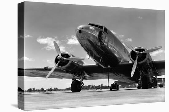 1940s DOMESTIC PROPELLER PASSENGER AIRPLANE DUAL ENGINE LANDING GEAR NOSE AND PARTIAL WINGS VISIBLE-H. Armstrong Roberts-Premier Image Canvas