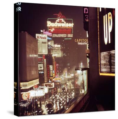 '1945: Broadway Ave with Traffic and Neon Billboards ...