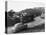 1950s AUSTIN CAR DRIVING UP THE HOLLYWOOD HILLS WITH HOLLYWOOD SIGN IN DISTANCE LOS ANGELES CA USA-Panoramic Images-Premier Image Canvas