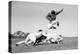 1960s FOOTBALL PLAYER JUMPING OVER BLOCKED PLAYERS-H. Armstrong Roberts-Premier Image Canvas