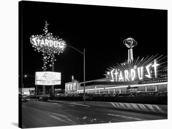 1960s Night Scene of the Stardust Casino Las Vegas,, Nevada-null-Premier Image Canvas