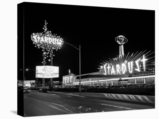 1960s Night Scene of the Stardust Casino Las Vegas,, Nevada-null-Premier Image Canvas