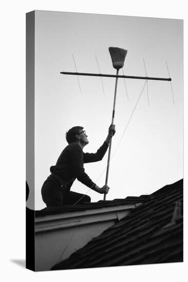 1967: Man Using a Broom to Improve the Antennae Reception During the Broadcast of Super Bowl I-Bill Ray-Premier Image Canvas