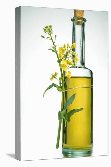 A Bottle of Rapeseed Oil with Flowers-Bodo A^ Schieren-Premier Image Canvas