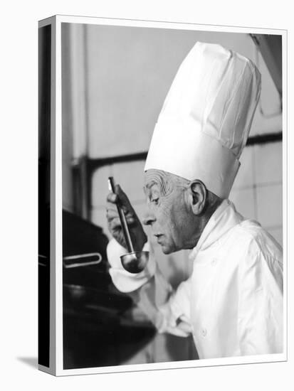 A Chef in a Chef's Hat Tastes Some Soup or Other Food from a Ladle-null-Premier Image Canvas