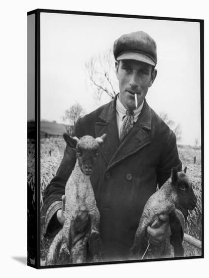 A Cotswolds Farmer Holds Two New-Born Lambs-Henry Grant-Premier Image Canvas