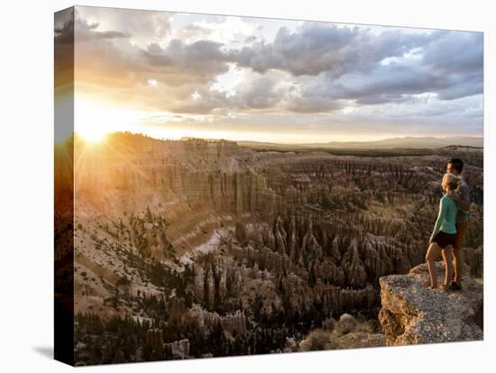 A Couple at Sunset in Bryce Canyon National Park, Utah, in the Summer Overlooking the Canyon-Brandon Flint-Premier Image Canvas