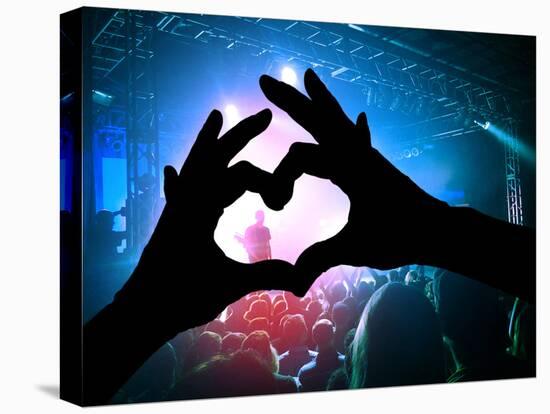 A Crowd of People at a Concert with a Heart Shaped Hand Shadow-graphicphoto-Premier Image Canvas