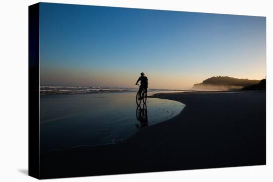 A Cyclist on Juquehy Beach at Sunset-Alex Saberi-Premier Image Canvas