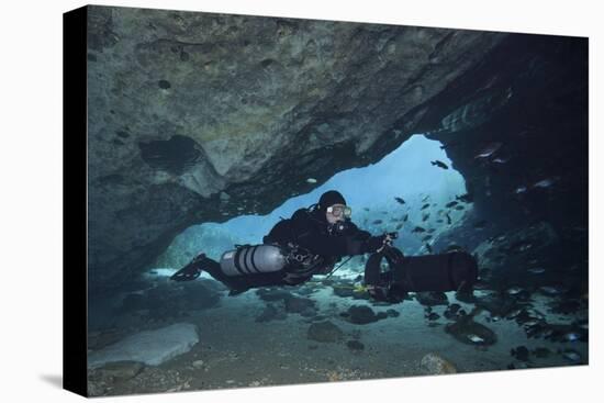 A Diver Using a Diver Propulsion Vehicle in the Blue Springs Cave System-null-Stretched Canvas