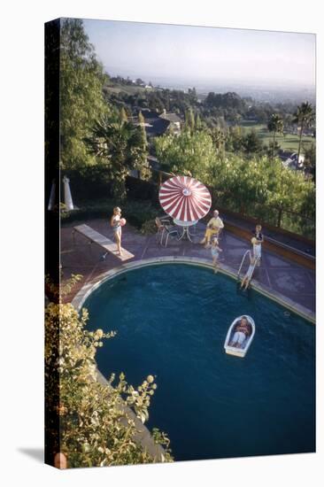 A Family at their Backyard Swimming Pool, in Foreground a Floating Rowboat with Boy Aboard-Frank Scherschel-Premier Image Canvas