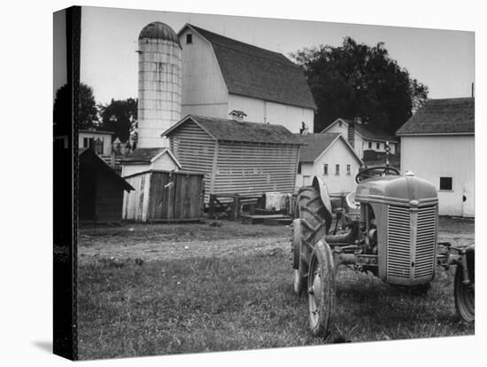 A Ford Tractor Being Sold During the Farmhouse Auction-null-Premier Image Canvas