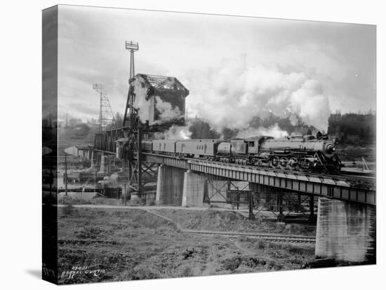 A Great Northern Railway Train on the G.N.R. Bridge across the Lake Washington Ship Canal in Ballar-Ashael Curtis-Premier Image Canvas