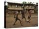 A Group of Panamanian Youths Slide Through the Mud During a Pick-Up Game of Soccer-null-Premier Image Canvas