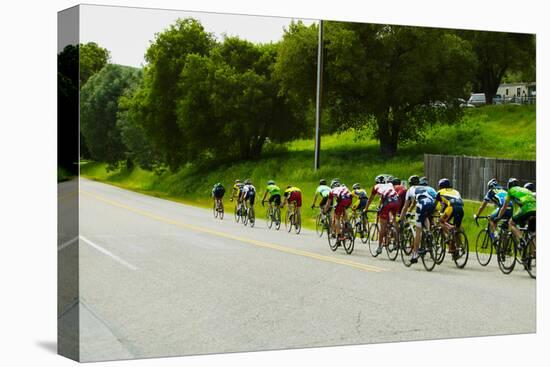 A group of road bicyclists traveling across highway 58 in CA-null-Premier Image Canvas