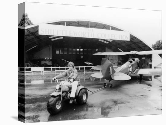 A Honda All Terrain Cycle Pulling a Vintage Biplane, 1982-null-Premier Image Canvas