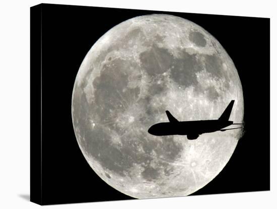 A Jet Plane Passes in Front of the Full Moon Above Surfside, Fla.-null-Premier Image Canvas