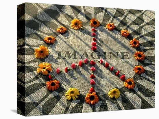 A Makeshift Peace Sign of Flowers Lies on Top John Lennon's Strawberry Fields Memorial-null-Premier Image Canvas