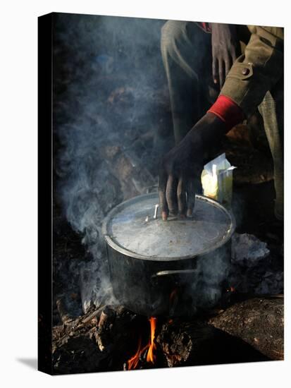 A Man, 24, from Ghana, Prepares His Meal-null-Premier Image Canvas