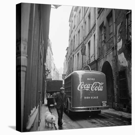 A Man Walks His Dog Beside a Bus with Coca Cola Advertisement, France, 1950-Mark Kauffman-Premier Image Canvas