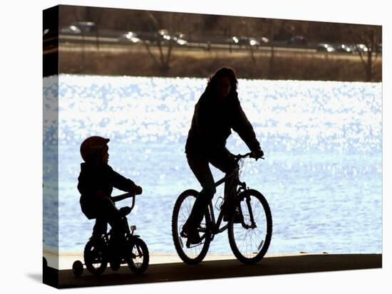 A Mother and Son are Silhouetted as They Ride Along the Schuylkill River-null-Premier Image Canvas