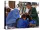 A Mother Watches as Her Child Gets a Haircut in the Center of Kabul, Afghanistan on Oct. 9, 2003.-null-Premier Image Canvas