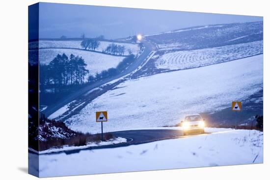 A Motorist Drives Through a Wintry Landscape on the B4520-Graham Lawrence-Premier Image Canvas