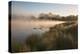 A Pair of Mute Swans, Cygnus Olor, Swim over a Misty Pen Pond at Sunrise in Richmond Park-Alex Saberi-Premier Image Canvas