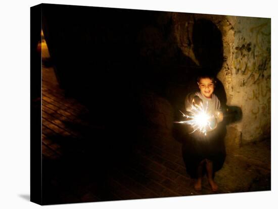 A Palestinian Boy Holds a Sparkler after Breaking the Fast on the First Day of Ramadan in Gaza City-null-Premier Image Canvas