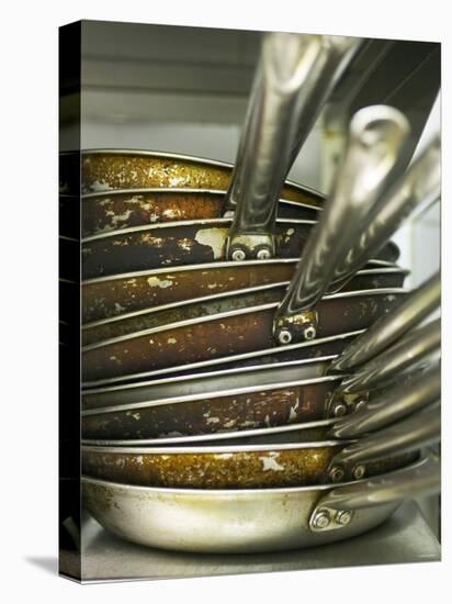 A Pile of Frying Pans in a Commercial Kitchen-Herbert Lehmann-Premier Image Canvas