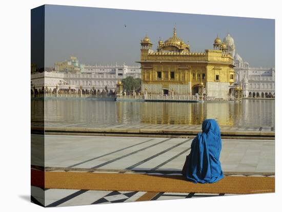 A Pilgrim in Blue Sits by the Holy Pool of Nectar at the Golden Temple, Punjab, India-Jeremy Bright-Premier Image Canvas