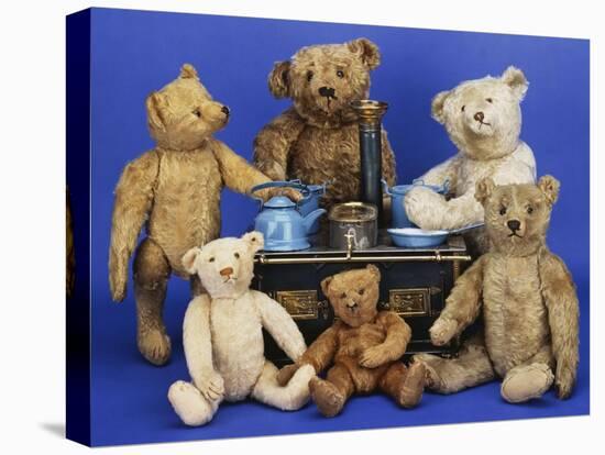 A Selection of Teddy Bears around a Black Painted Tinplate Toy Stove-null-Premier Image Canvas