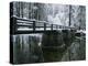 A Snow-Covered Footbridge Spanning the Merced River-Marc Moritsch-Stretched Canvas