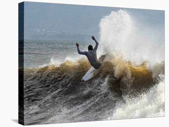 A Surfer Takes The Top Of A Wave In Santa Barbara, Ca-Daniel Kuras-Premier Image Canvas