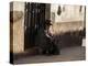 A Traditional Bolivian Woman Sits on a Doorstep in Potosi at Sunset-Alex Saberi-Premier Image Canvas