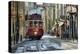 A tramway in Alfama district with the Motherchurch (Se Catedral) in the background. Lisbon, Portuga-Mauricio Abreu-Premier Image Canvas