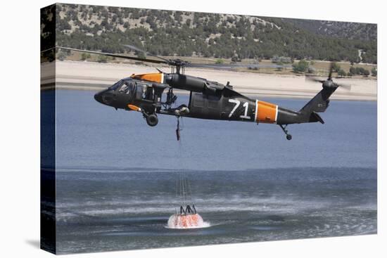 A U.S. Army Uh-60 Black Hawk Helicopter Collects Water from a Reservoir-null-Premier Image Canvas