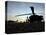 A UH-60 Black Hawk Helicopter on the Flight Line at Sunset-null-Premier Image Canvas