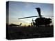 A UH-60 Black Hawk Helicopter on the Flight Line at Sunset-null-Premier Image Canvas