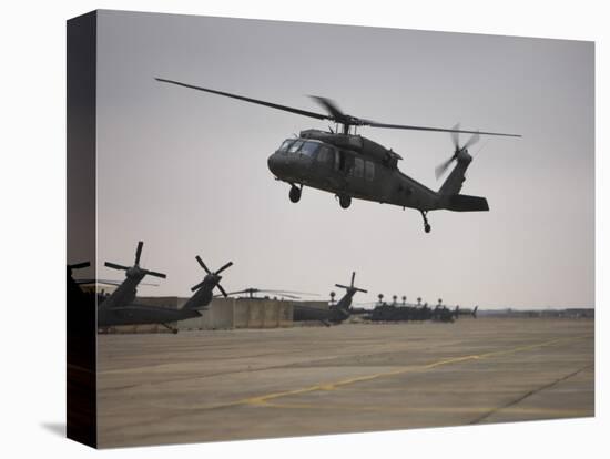 A UH-60 Black Hawk Taking Off for a Mission over Northern Iraq-null-Premier Image Canvas